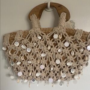 Made in India Beige Woven Handbag with Shell Accents